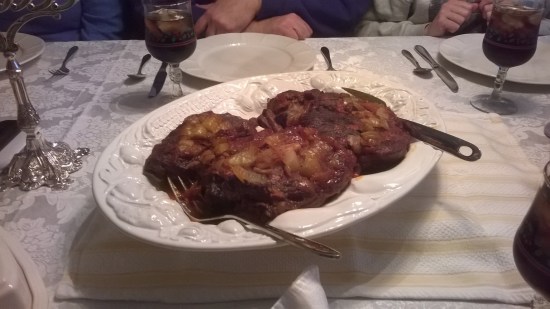 Eager hands waiting to attack the brisket after prayer.